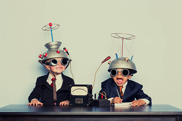 Boys Dressed as Businessmen Wearing Mind Reading Helmets Two young boys are ready to dive into the brain of your business. Analyze that. Expectations stock pictures, royalty-free photos & images